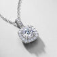Close-up view of pave-set bail and cushion halo diamond setting on pendant.