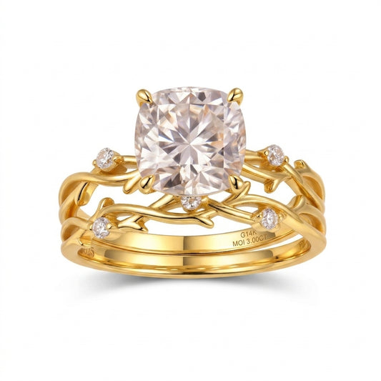Front view of cushion cut moissanite botanical twig ring nested with matching band.