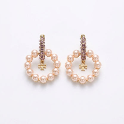 White background pure e-commerce studio view of premium designer style crystal double T logo pearl hoop earrings.