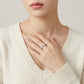 Model wearing the light luxury double row moissanite half eternity ring in a lifestyle setting.