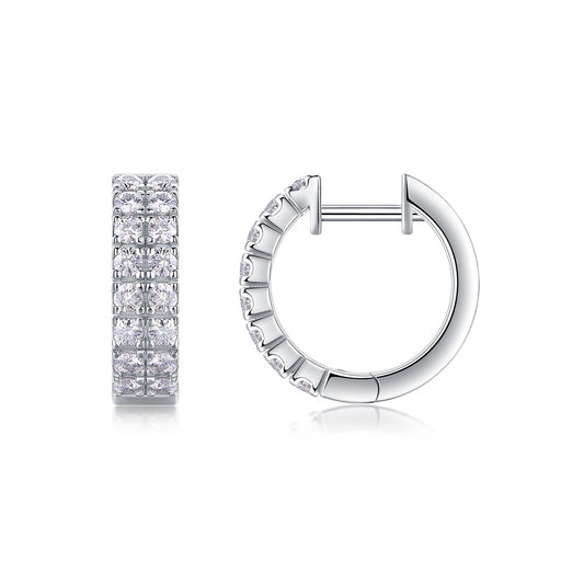 Double row moissanite huggie hoop earrings with pave hinged sleeper closure on white background.