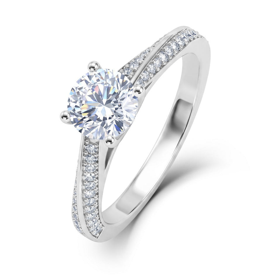 Angled perspective shot of double row pavé engagement ring showing side stone rows.