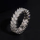 Close up side view showing prong setting of double row round moissanite full eternity ring