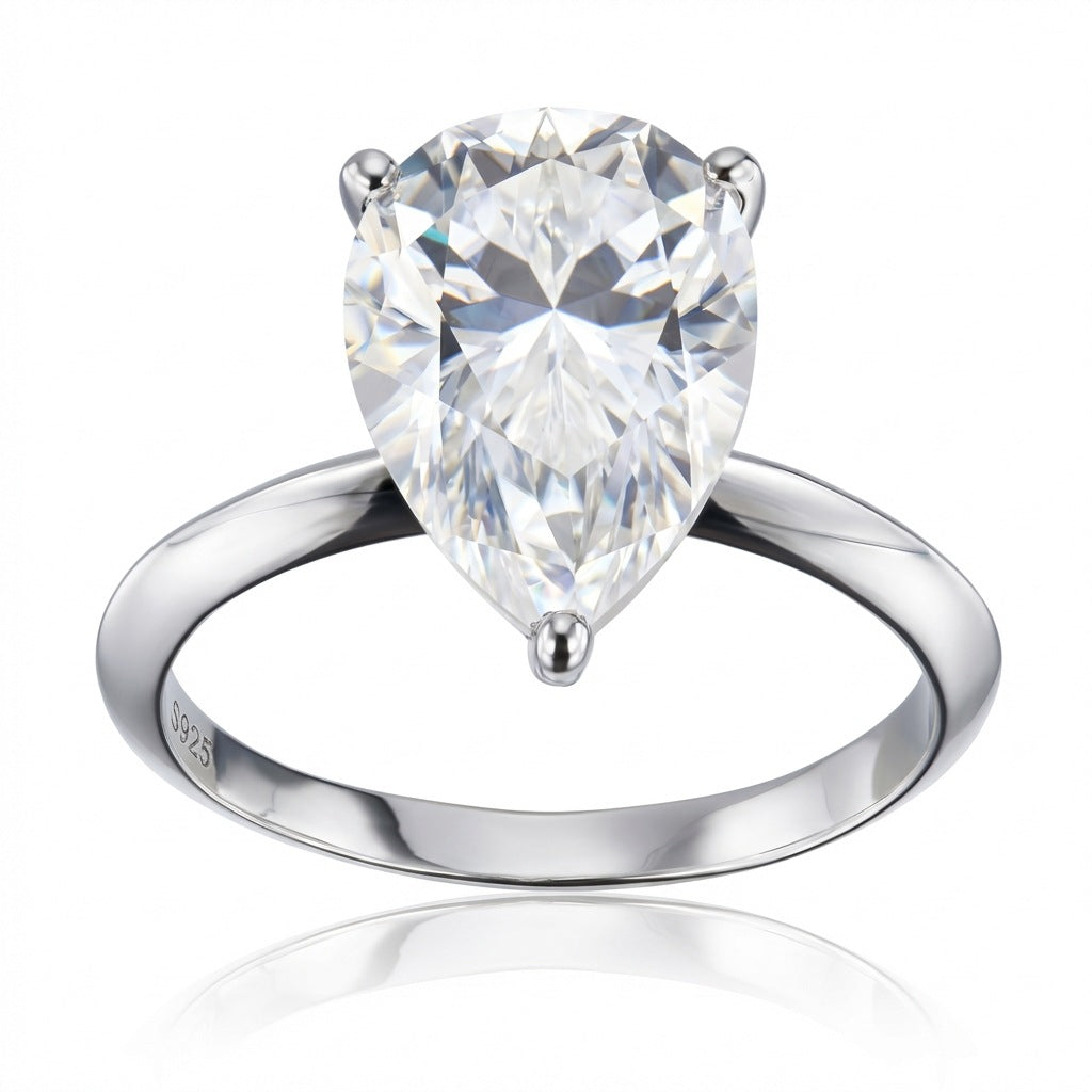 Front view of the east-west set pear moissanite teardrop solitaire ring on white background.
