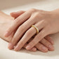 Closeup lookbook wear shot of a model's hands gracefully displaying the effortless luxury minimalist round gemstone eternity band.