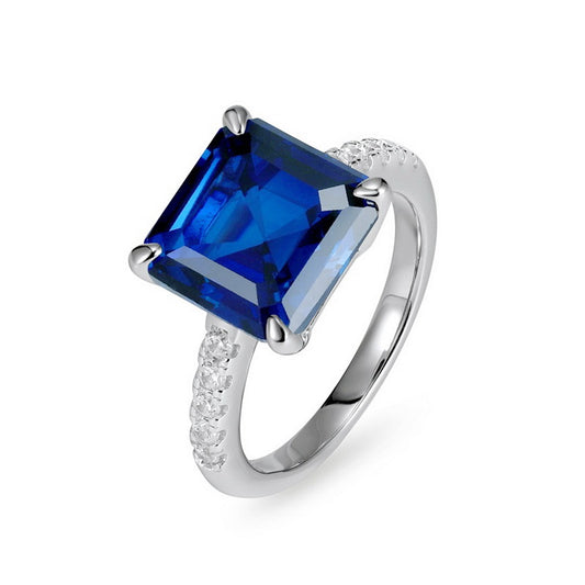 Elegant minimalist square blue sapphire statement ring for women featuring a large radiant asscher-cut blue gemstone.