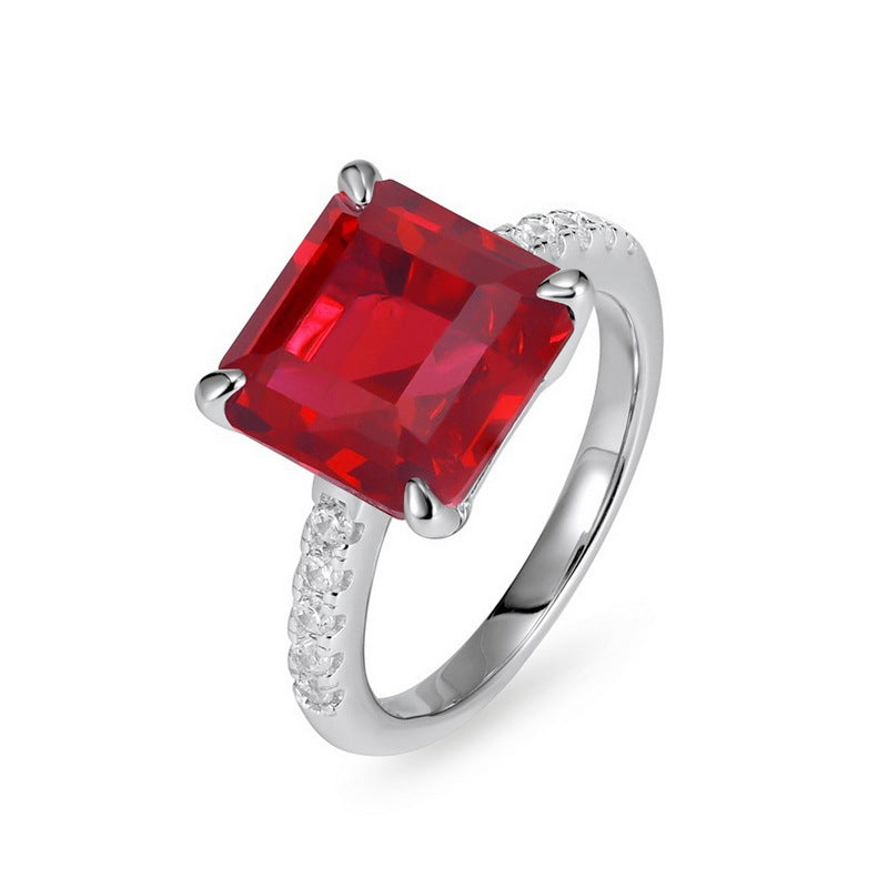 Elegant minimalist square ruby statement ring for women featuring a large radiant asscher-cut red gemstone.