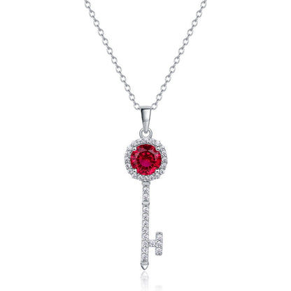 Elegant ruby secret sovereign key pendant necklace featuring a round-cut red gemstone with diamond halo.