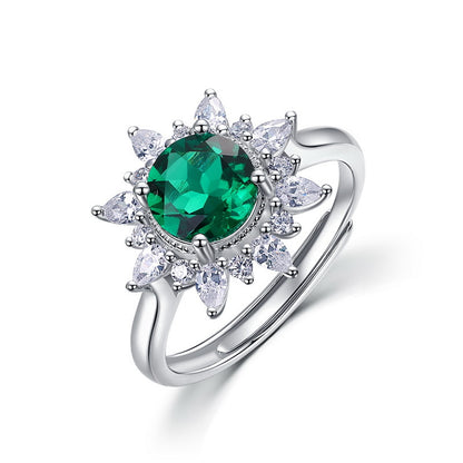 Elegant sunflower emerald statement ring for women featuring a round-cut green gemstone with cluster floral marquise petals.
