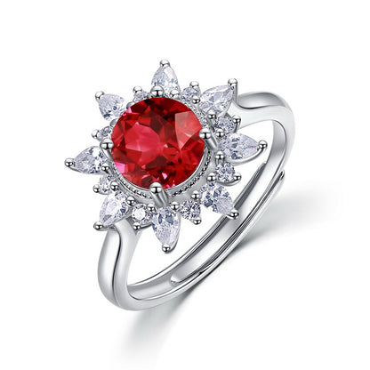 Elegant sunflower ruby statement ring for women featuring a round-cut red gemstone with cluster floral marquise petals.