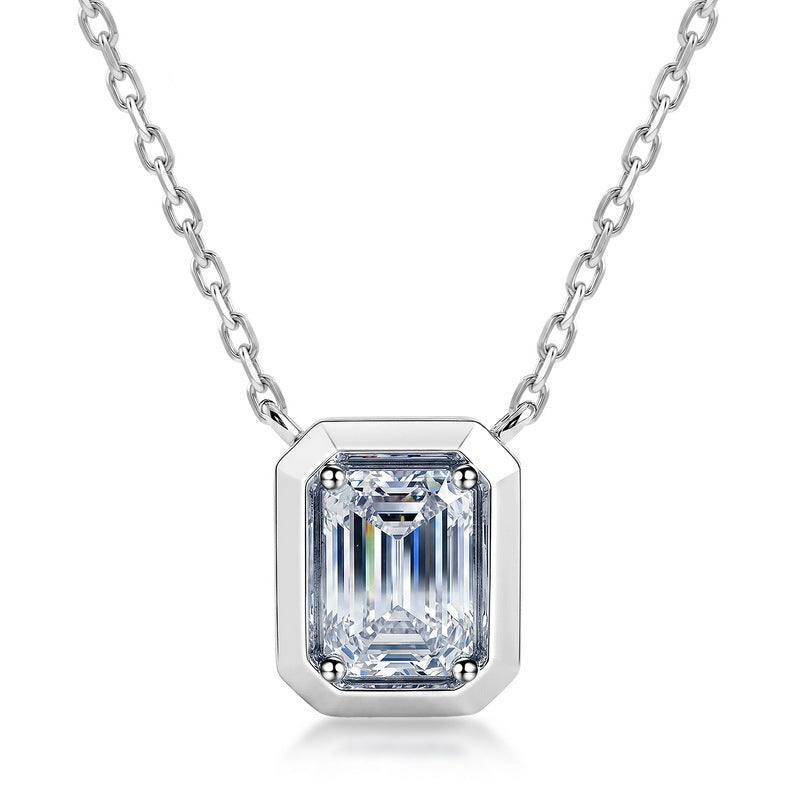 Emerald cut diamond bezel-prong solitaire pendant necklace in platinum-plated sterling silver.