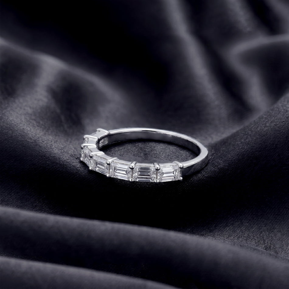 Side profile shot of 1.45ct emerald cut lab diamond half eternity band ring.