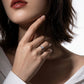 Lifestyle view of model displaying emerald cut lab grown diamond hidden halo ring.