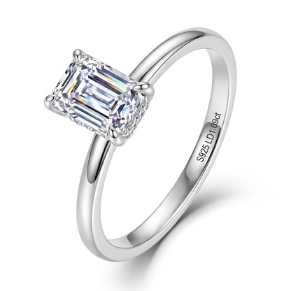 Emerald cut lab grown diamond hidden halo engagement ring in 925 silver.