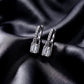 Side profile view showing clasp mechanism of emerald cut lab grown diamond padlock huggie earrings