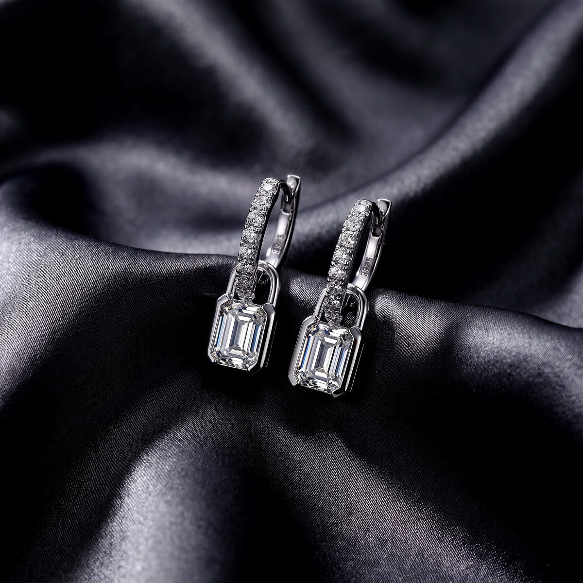 Side profile view showing clasp mechanism of emerald cut lab grown diamond padlock huggie earrings