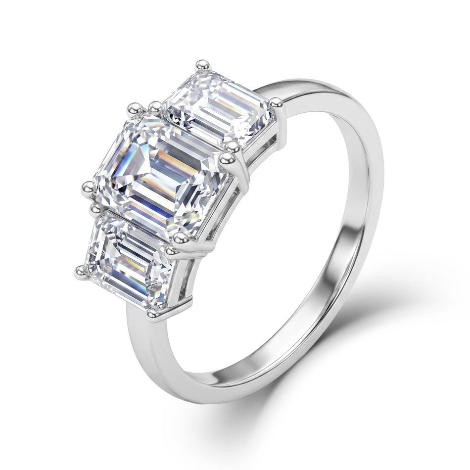 Emerald cut lab grown diamond three stone engagement ring in 925 silver.