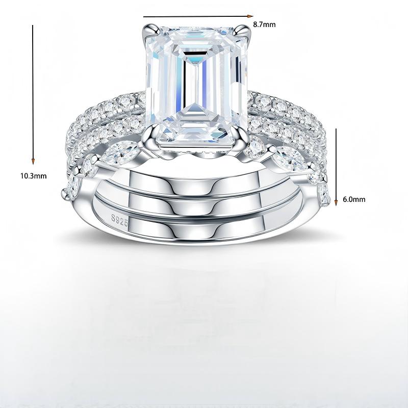 Technical specification chart detailing the height, band width, and emerald cut center stone size of 3-piece stacking ring set.