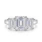 Direct top view showing graduated emerald cut three stone ring layout.