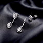 Convertible emerald and pear cut halo lab grown diamond drop ear jacket set on dark black silk