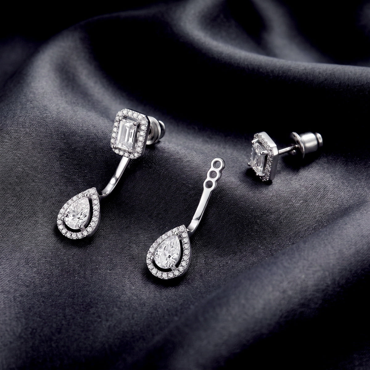 Convertible emerald and pear cut halo lab grown diamond drop ear jacket set on dark black silk