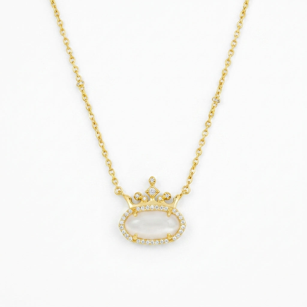 Kendra Scott x Disney Elisa Princess gold crown necklace featuring a white mother of pearl stone.
