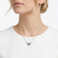 Close-up lifestyle portrait view of a model showcasing an ethereal sapphire butterfly statement pendant necklace.