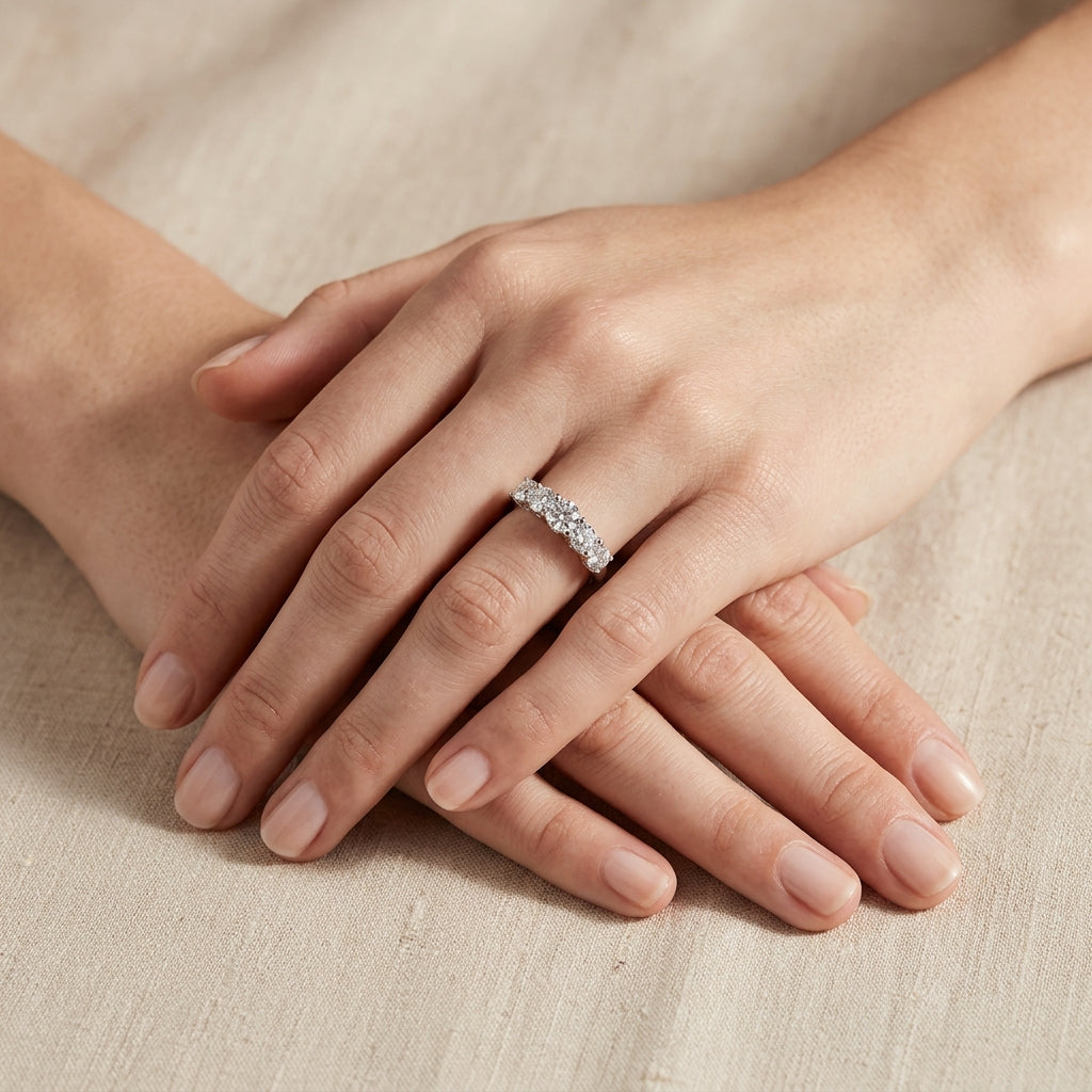 Model wearing classic five-stone round brilliant lab grown diamond wedding ring.