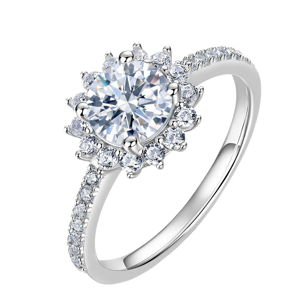 Floral sunburst halo lab grown diamond engagement ring in sterling silver isolated on white background