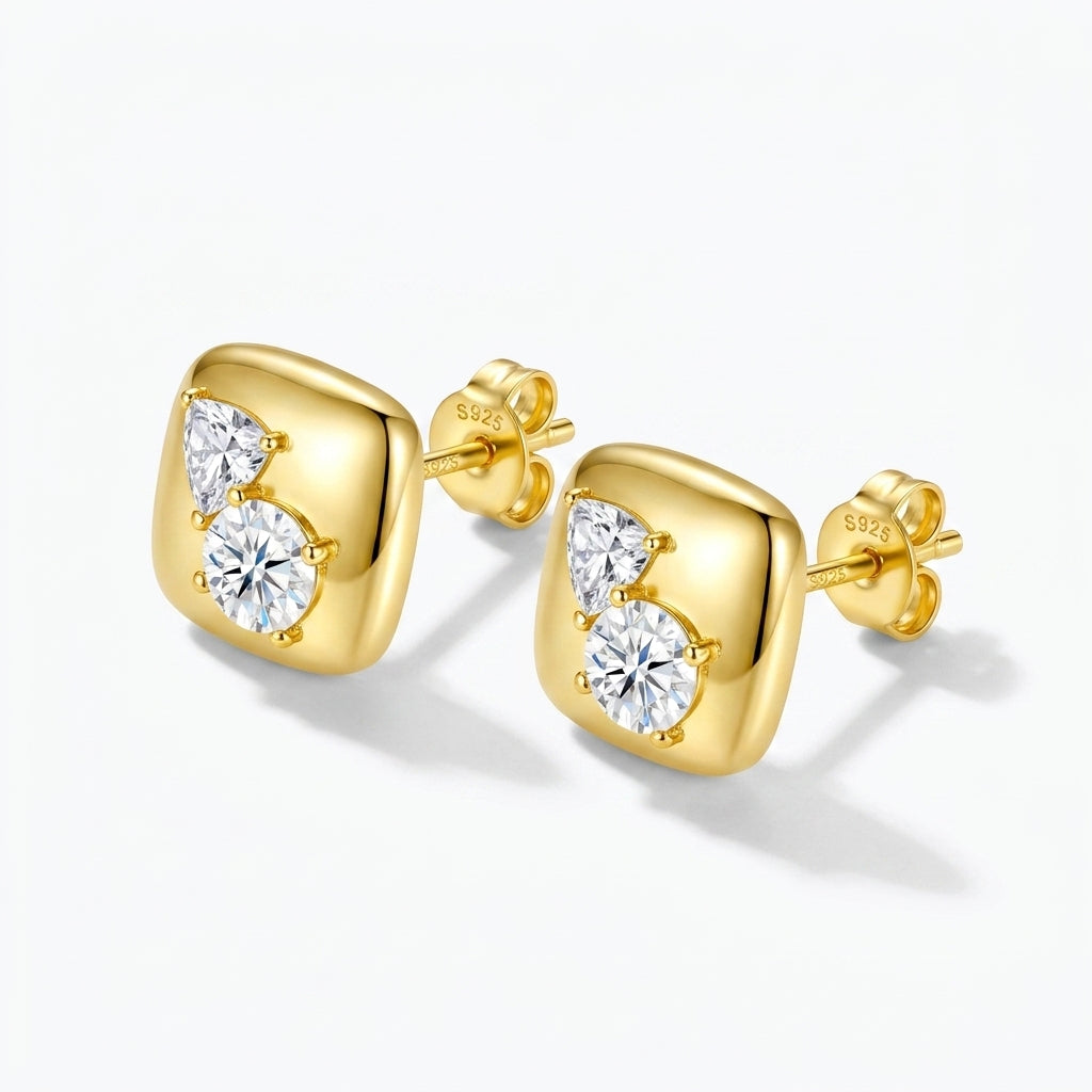 Studio macro close-up view highlighting sculpted gold cushion square frame set with heart and round moissanite stones.