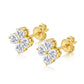 Angled studio view showing secure push-back post, golden prongs, and heart-shaped moissanite clover design.