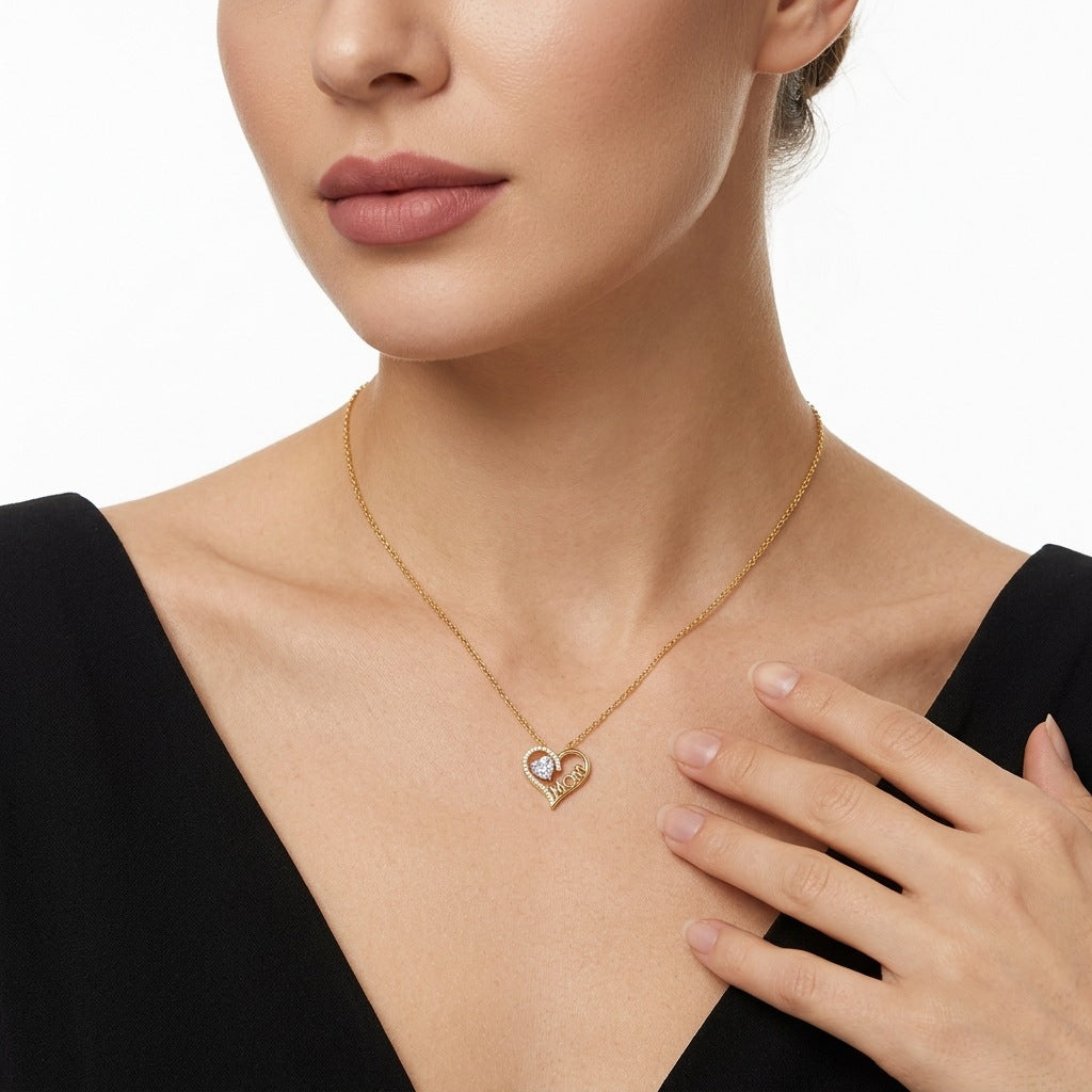 Model wearing the classic gold MOM heart gemstone pendant necklace in a portrait view.
