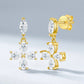 Gold moissanite floral cross drop earrings showing dangling jump ring and friction post back closure.