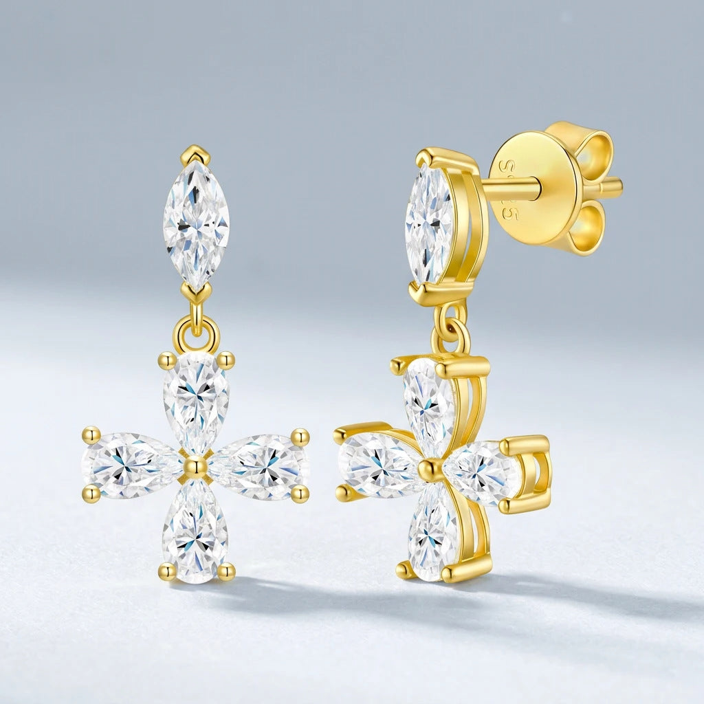 Gold moissanite floral cross drop earrings showing dangling jump ring and friction post back closure.