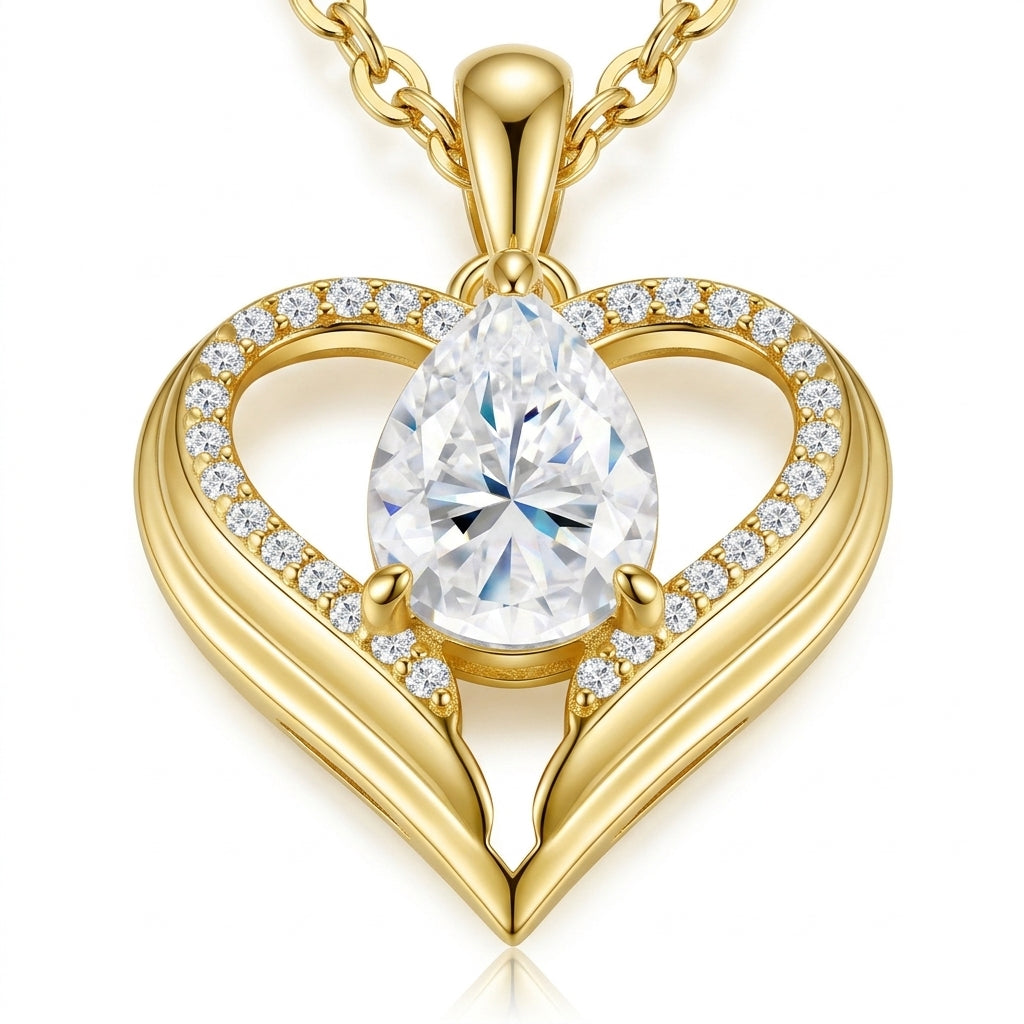 Close-up of pear-cut moissanite set in gold open heart pendant, featuring brilliant sparkle