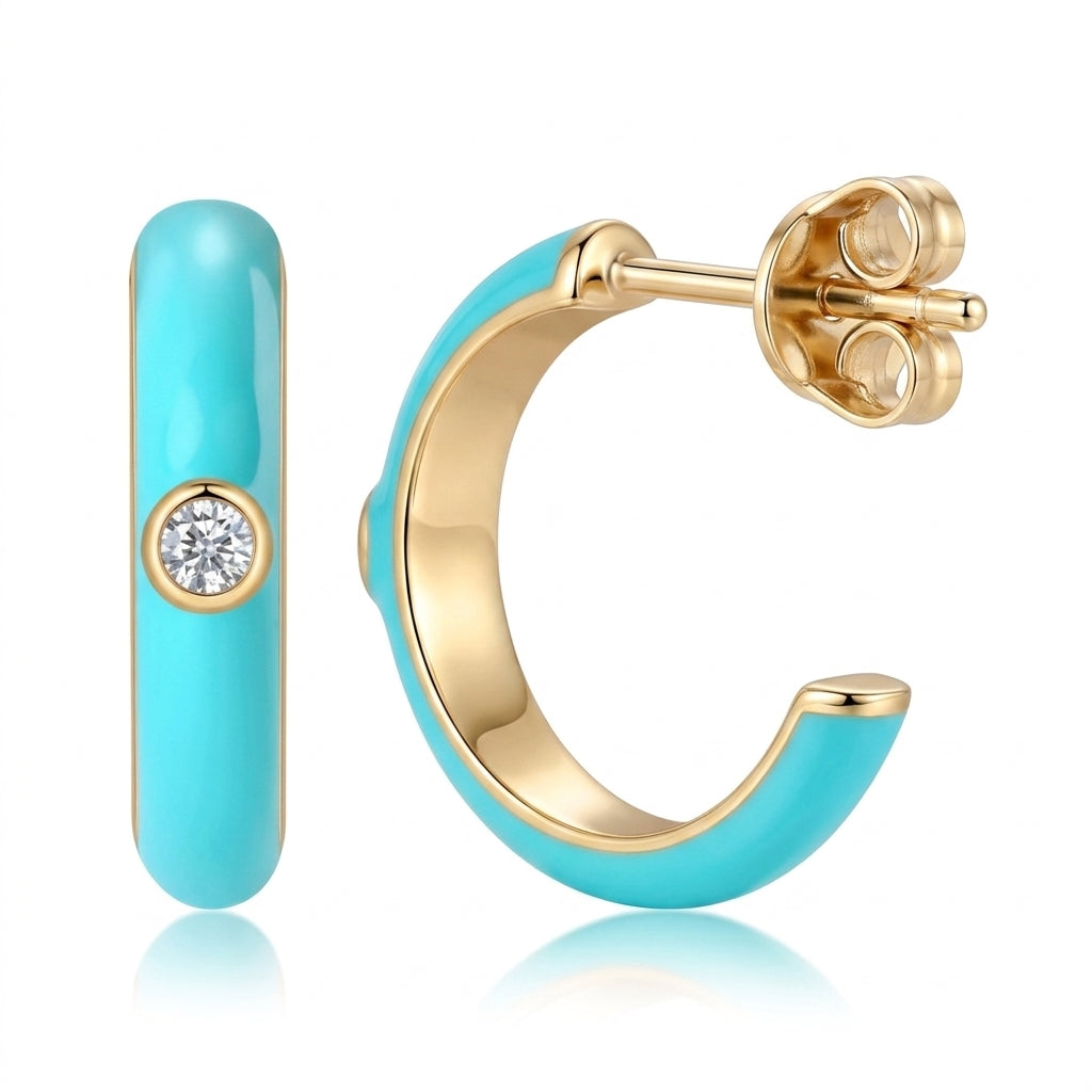 Frontal and profile view of gold turquoise enamel open hoop earrings featuring center bezel-set moissanite.