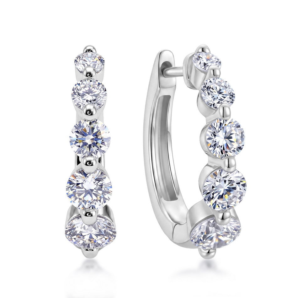 Side view of graduated lab-grown diamond journey huggie hoops showing click-top closure.