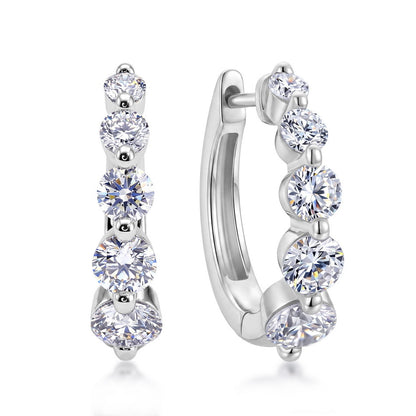 Side view of graduated lab-grown diamond journey huggie hoops showing click-top closure.
