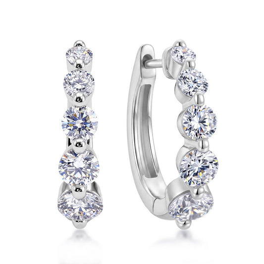 Side view of graduated lab-grown diamond journey huggie hoops showing click-top closure.