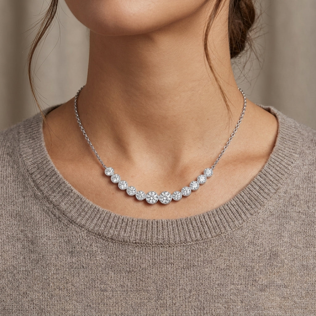 Model showing graduated moissanite bezel set smile bar necklace for daily fine jewelry style.