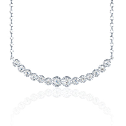 Graduated moissanite curved smile bar necklace with bezel set journey pendant on white background.