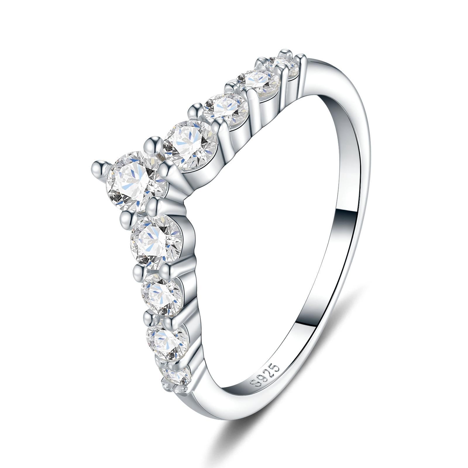 Silver graduated round cut moissanite chevron stacking ring showing S925 hallmark on white background.
