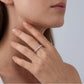 Woman wearing delicate half eternity lab grown diamond stacking ring on finger
