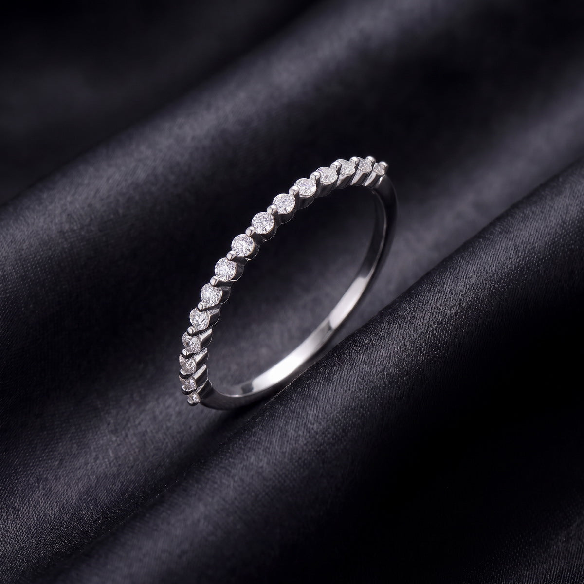 Slim half eternity lab grown diamond wedding band set on dark black silk fabric