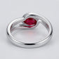 Studio product view focusing on the sleek gallery profile and inner band of a handcrafted bezel-set ruby solitaire ring.