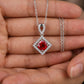 Handheld view in the palm under golden-hour natural light capturing a handcrafted lab-grown ruby diamond-shaped pendan