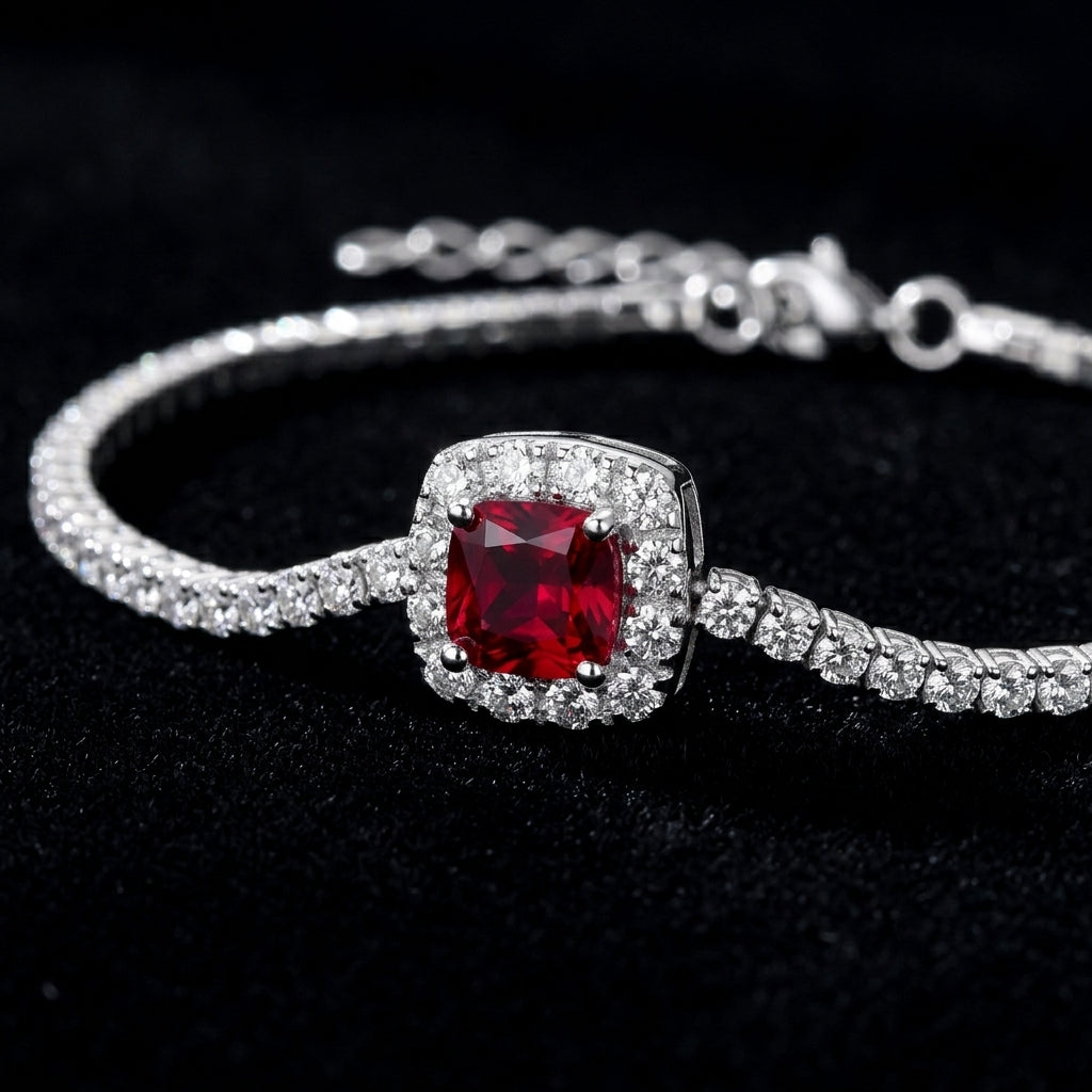 Dark black background close-up product view of a handcrafted pave diamond ruby tennis chain bracelet.