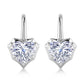 Pair of heart cut moissanite shepherd hook drop earrings in 925 sterling silver.