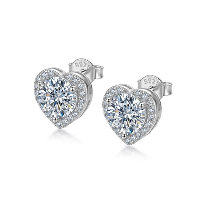Heart halo round cut lab grown diamond stud earrings in sterling silver isolated on white background