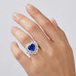 Elegant heart blue sapphire halo ring worn on hand, featuring minimalist vintage aesthetic